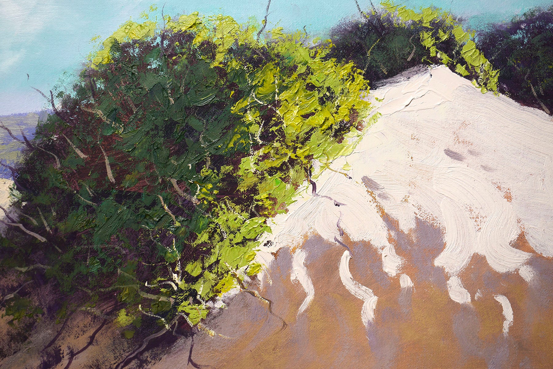 Sunlit coastal sand dunes with blue ocean view, painted in oils