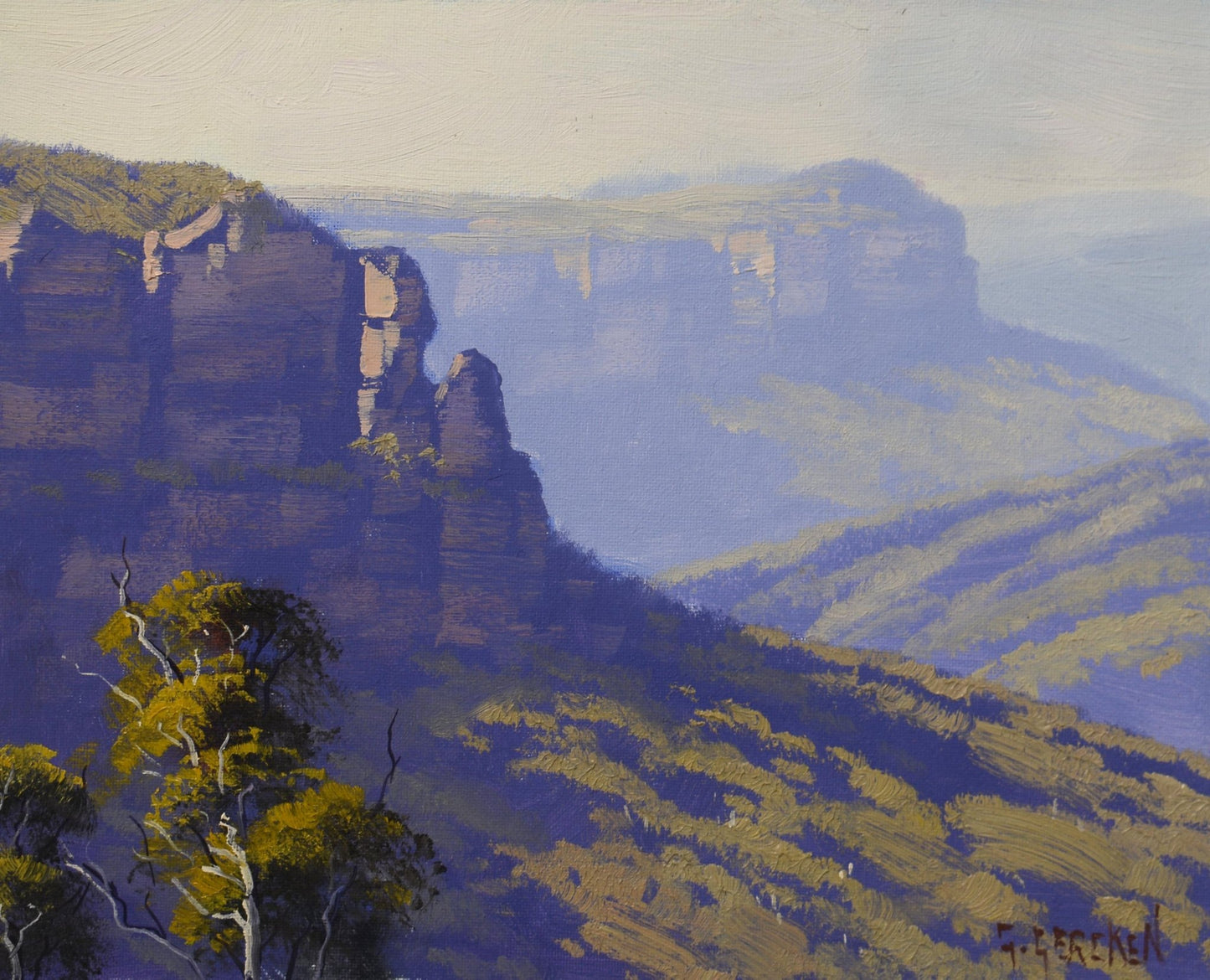 An oil painting of a dramatic mountain landscape with tall rock cliffs, layered blue-purple mountains in the background, and green-yellow vegetation under a pale sky. Signed in the lower right corner.