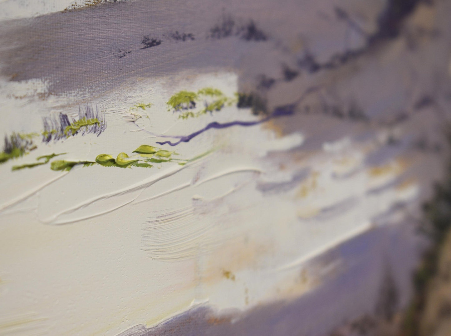 Close-up of a textured surface with white, gray, and green colors