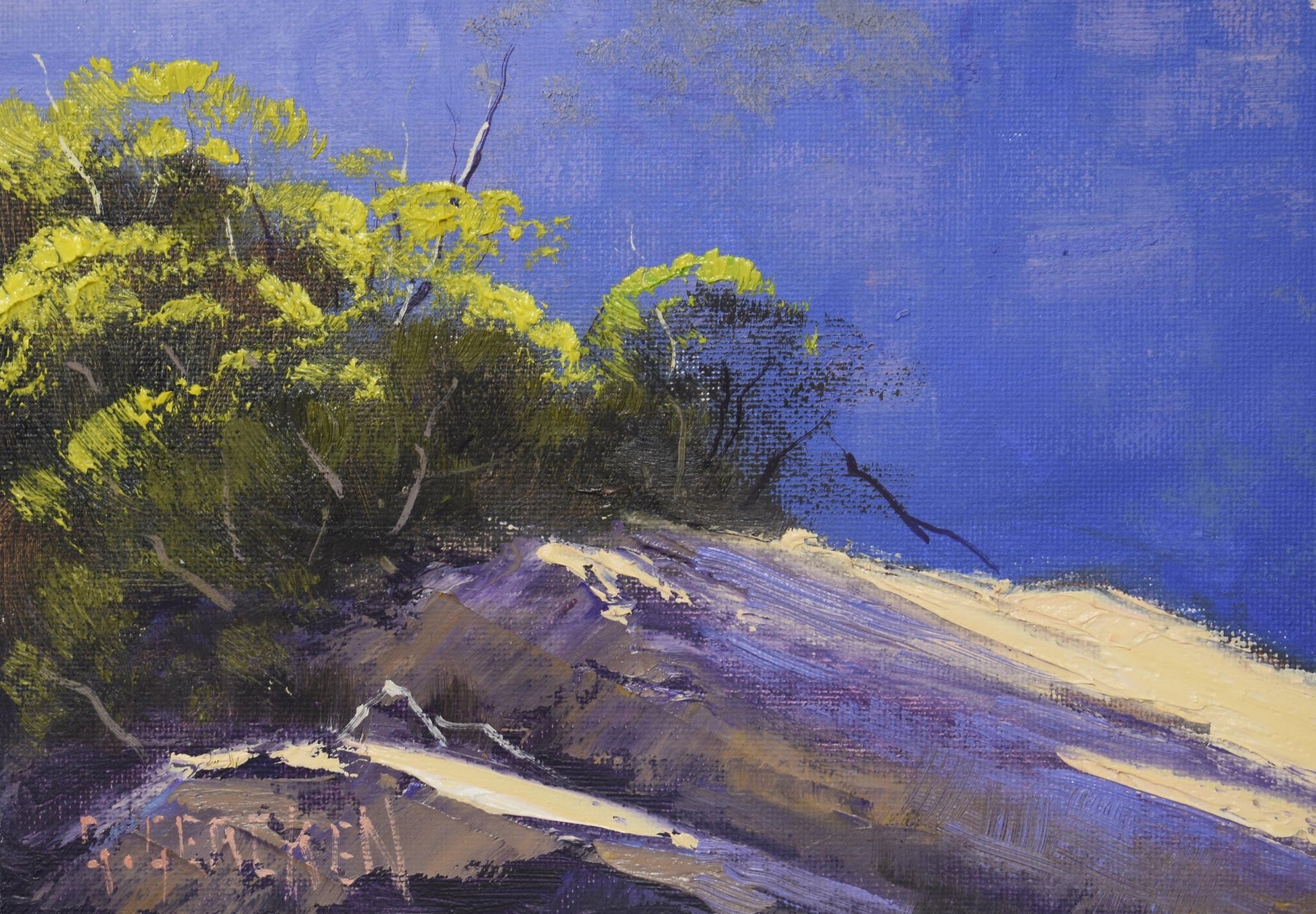 Painting of a coastal landscape with trees and cliffs.