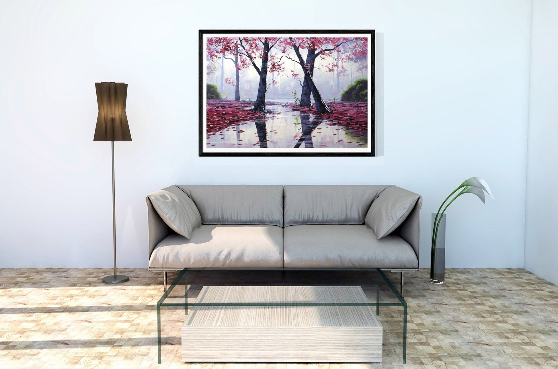 Modern living room with a sofa, coffee table, and framed artwork of cherry blossoms.