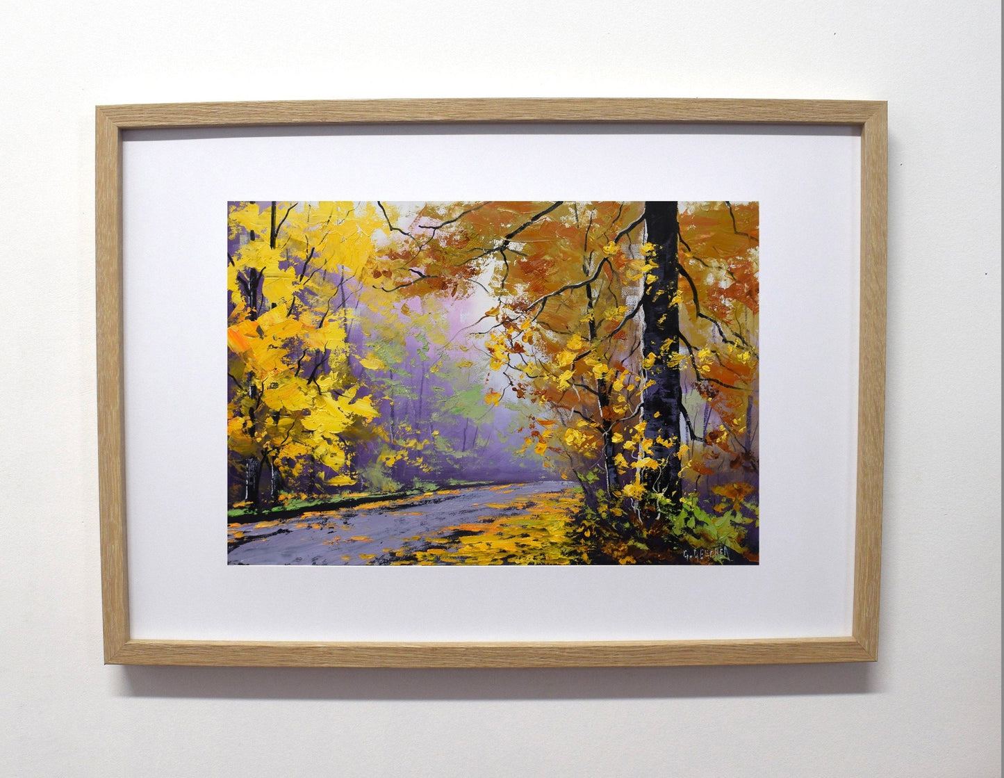 Framed painting of a autumn landscape with trees and a path.