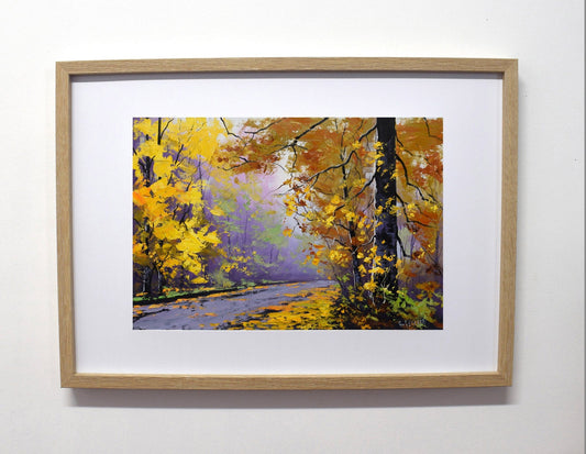 Framed painting of a autumn landscape with trees and a path.
