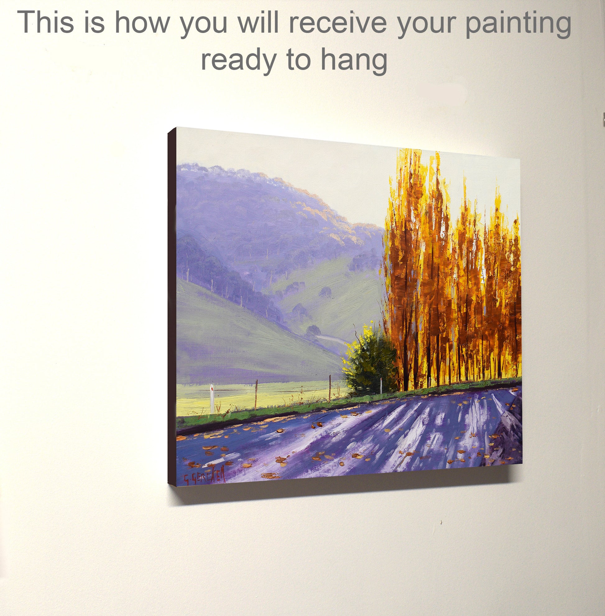 Painting of a landscape with trees and mountains on a white wall.